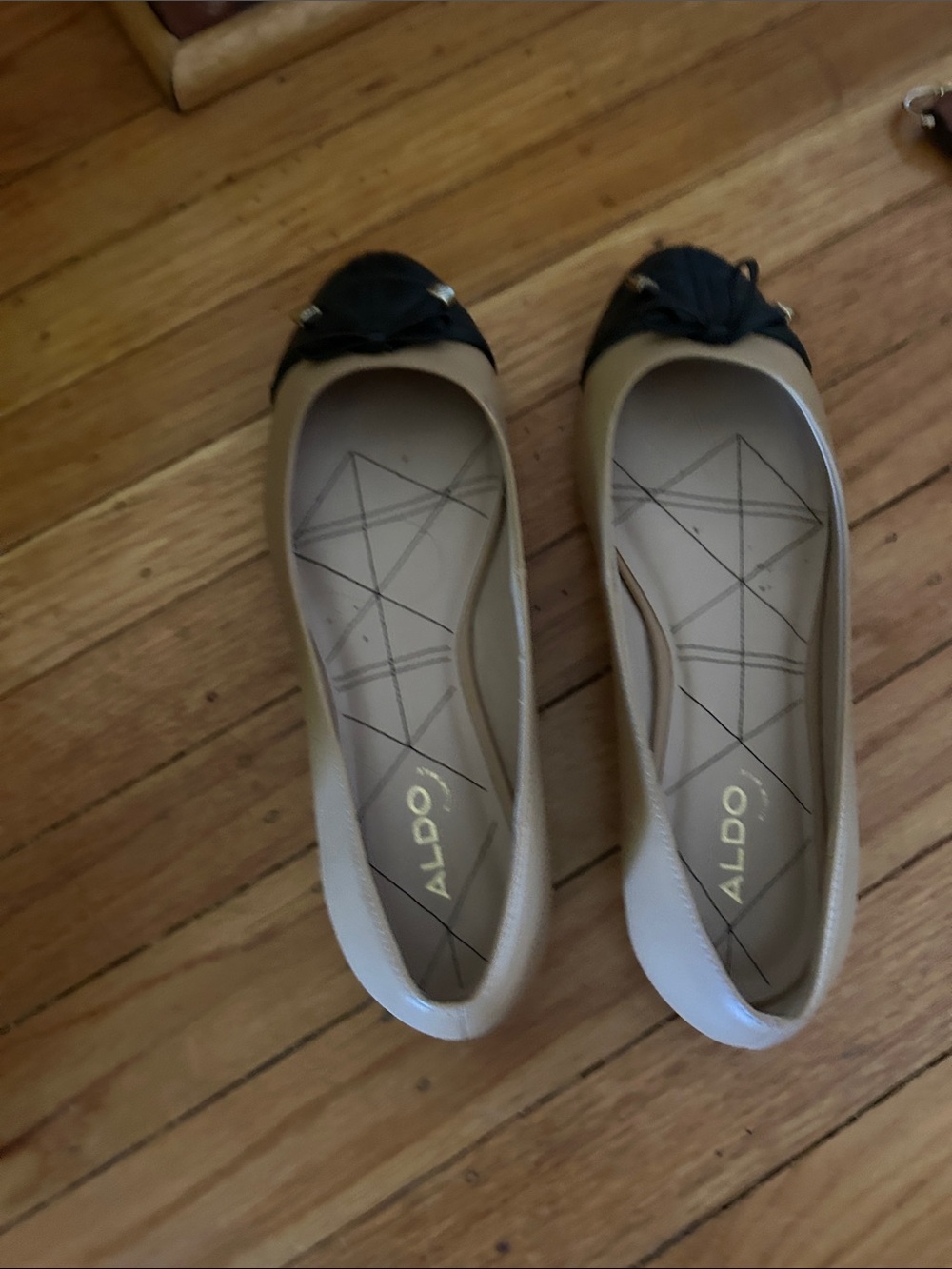 Aldo Beige Flats with Black Cap Toe and Bow